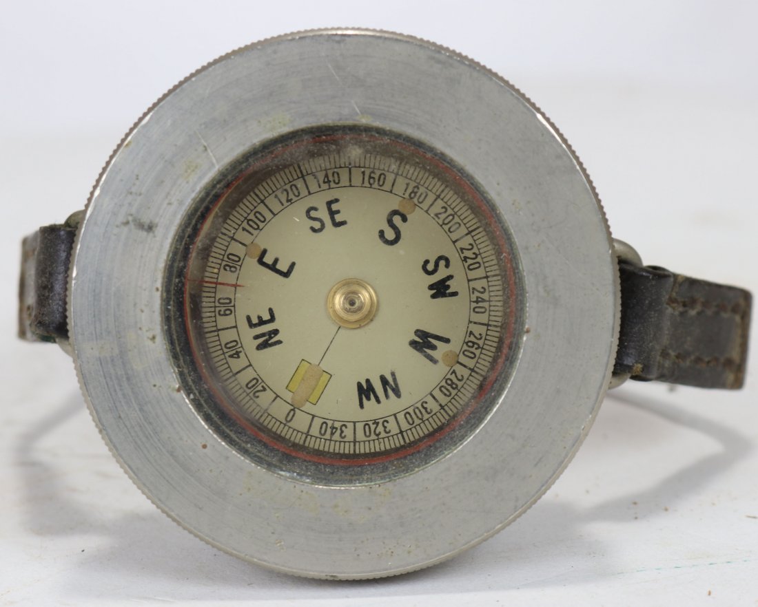 Very Large Vintage Metal Cased Divers Wrist Compass: Impressive compass that would strap to a divers wrist. Appears to be nickel platted brass case with a leather strap. Compass works. Fairly heavy case measures just under 3 inches round and 1.25 inches