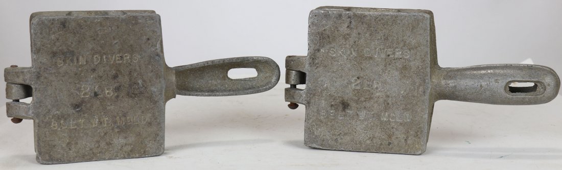 2 US Divers Skin Diver Lead Weight Belt Molds 2 Pounds: A pair of molds to make 2 pound lead weights. Outside of the molds say Skin Divers Belt WT Mold 2 lb and the other side says US Divers Co; 3323 West Warner Ave; Santa Ana, CA 92702. Each model is hing