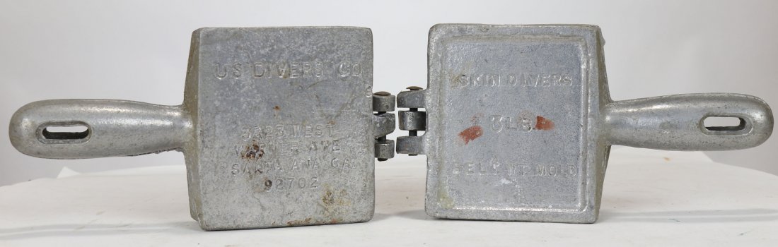 2 US Divers Skin Diver Lead Weight Belt Molds 3 Pounds: A pair of molds to make 3 pound lead weights. Outside of the molds say Skin Divers Belt WT Mold 3 lb and the other side says US Divers Co; 3323 West Warner Ave; Santa Ana, CA 92702. Each model is hing