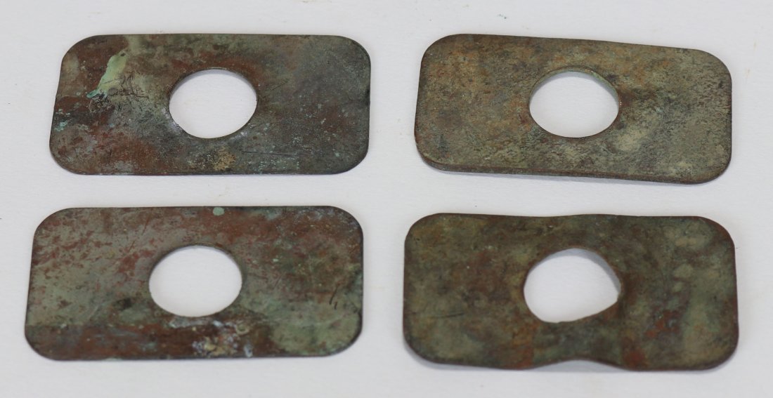 US Navy Mark V Diving Helmet Copper Brail Shims (4): Missing in many cases from the US Navy Mark V diving helmet. These original copper shims would be located at each of the four points where the brails meet. They are used to prevent damage to the rubbe