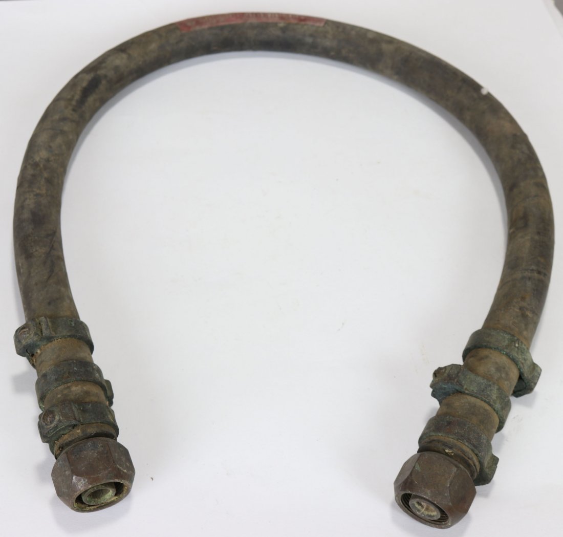 US Navy Mark V Diving Helmet Air Control Hose Whip 1944: Original air control hose or whip used with the Mark V diving helmet. This is a World War 2 example made by Republic Rubber in 1944. Hose is in used condition but could be cleaned up for display purpo