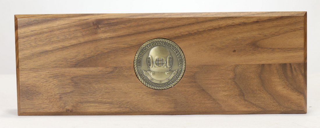 HDS Challenge Coin Set of 5 In Wood Presentation Box: Helmets In History challenge coin set of 5 in wood presentation box. This serial numbered set features the US Navy Mark III, Mark II, Mark IV and Mark XII diving helmets. There is also a 5th coin on t