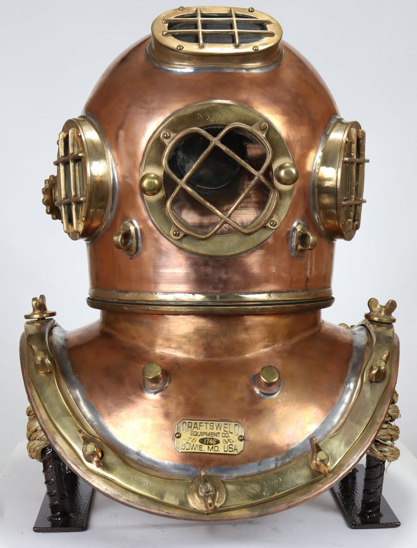 Craftsweld 4 Light 12 Bolt Polished Diving Helmet: This helmet was made by the Craftsweld Equipment Company. When this helmet was made the Craftsweld name was owned by the A. Schrader Diving Equipment Company located in Bowie, Maryland. This company w