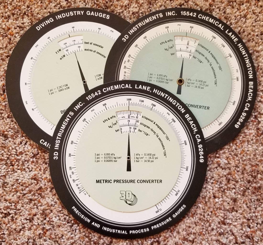 Lot of 3 Diving Industry Metric Pressure Converters: Grouping of 3 new old stock manual diving industry metric pressure converter calculator or converters. Made by 3D Instruments located in Huntington Beach, CA.