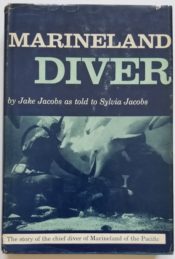 Marineland Diver by Jake Jacobs 1960 First Edition: Marineland Diver. The story of Jake Jacobs who was the chief diver at Marineland of the Pacific. Several photos of Jacobs working in a Miller Dunn style 3 helmet and also one of him wearing a period M