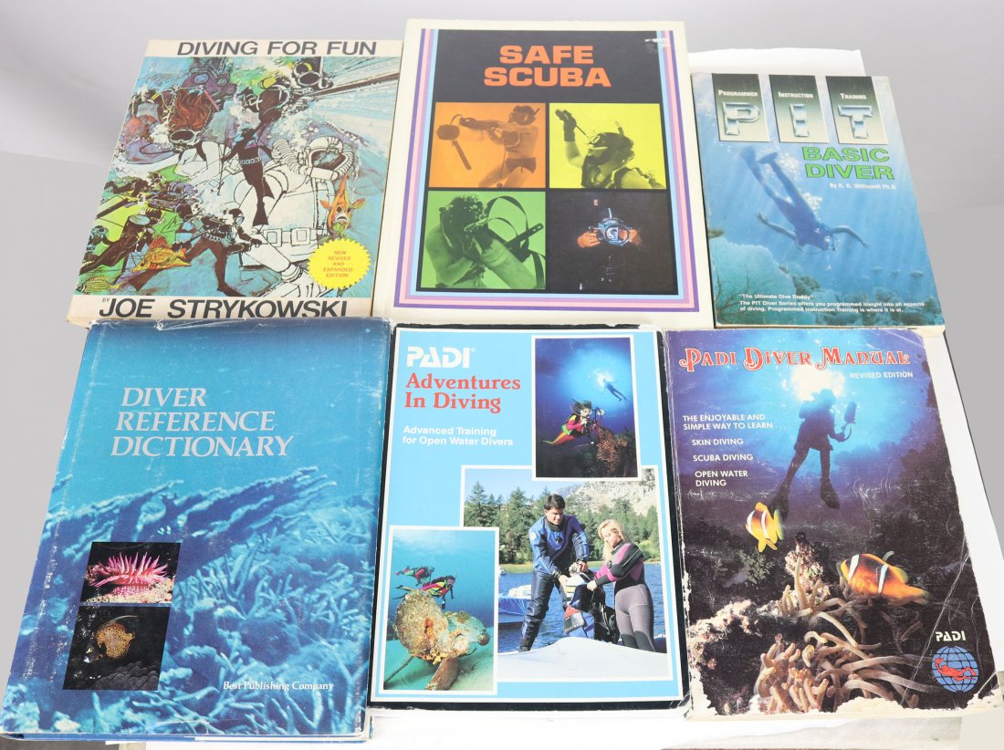 6 Vintage SCUBA Diving Reference Books: Lot of 6 SCUBA diving books and reference manuals. The titles are Diving For Fun, Safe Scuba, Basic Diver, Diver Reference Dictionary, PADI Adventures In Diving and PADI Diver Manual. Good Used Condit