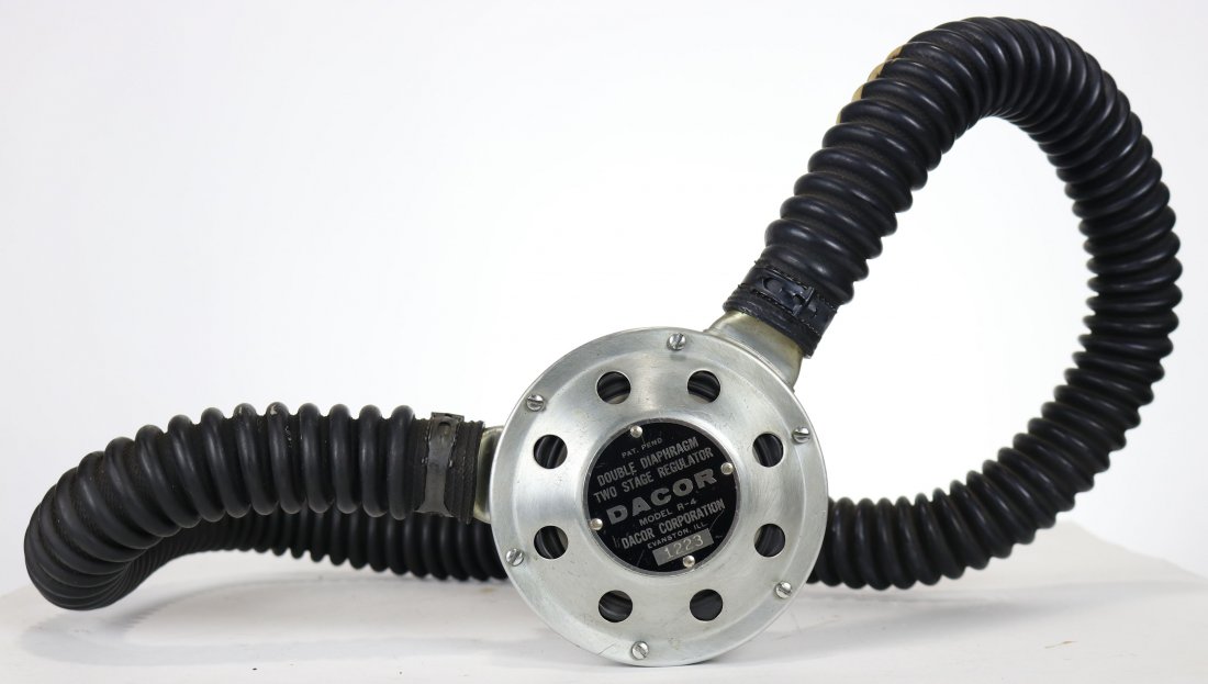Dacor Dial-A-Breath R-4 Regulator 1962-63: Very nice example of a DACOR model R-4 double diaphragm two stage regulator. Features the Dial-A-Breath feature. Circa 1962 to 1963. Condition of the rubber hose and mouthpiece can be seen in photos.