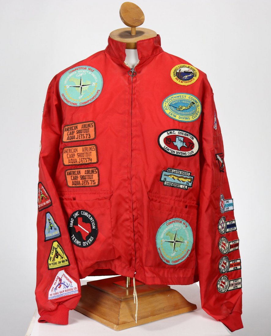 One of a Kind Spearfishing Tournament Jacket: Circa 1970s nylon light weight jacket with 24 spearfishing tournament patches! The original owner was and is an avid spearfishing competitor and also lifelong diver. Jacket features his club, Inland D