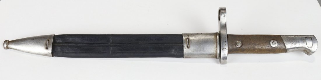 Spanish Bayonet M1893 With Leather & Steel Scabbard: Spanish bayonet made for use on the 7mm Spanish Mauser rifle. These were used in the 1890s and into the 20th Century. The ricasso is stamped Artilleria FCA; De Toledo; 1898. This information is worn c