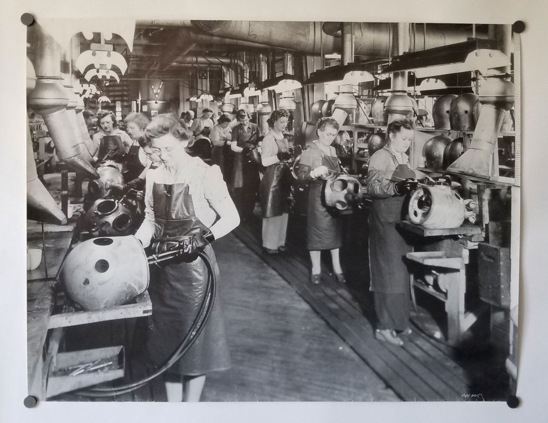 Poster of Women At DESCO Factory During WWII: Incredible image made into a poster of women making Mark V diving helmets during World War 2. Amazing detail to this image. Measures 24x31 inches, slight creasing.