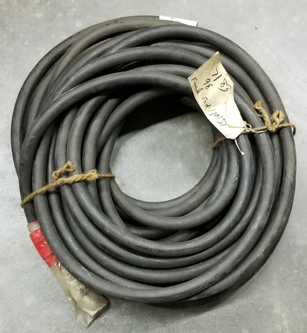 US Navy Mark 12 Diving Helmet Air Line Hose 50 Feet: Original roll of 50 feet of air line hose used with the Mark 12 diving helmet. Hose was last inspected in 1983. Is missing female fitting from one end.