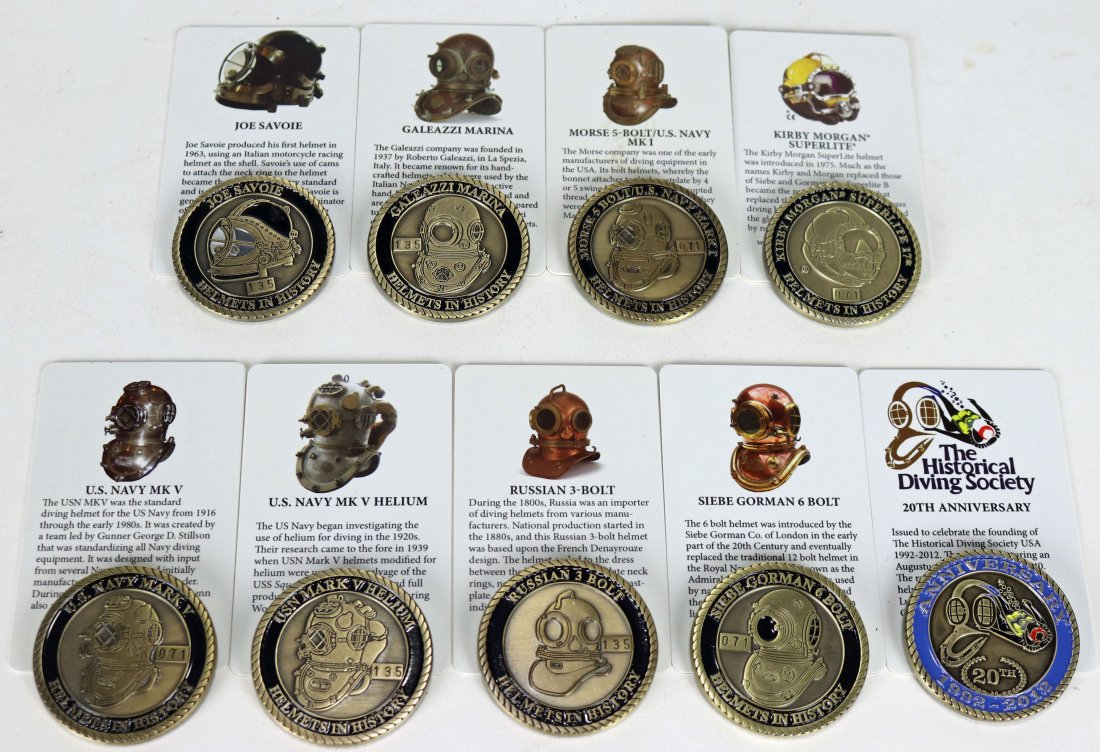 9 Historical Diving Society Challenge Coins w/ Cards: Collection of 9 challenge coins produced by the Historical Diving Society USA. Each coin is accompanied by a matching plastic information card with details about the helmet. The helmets in this collec