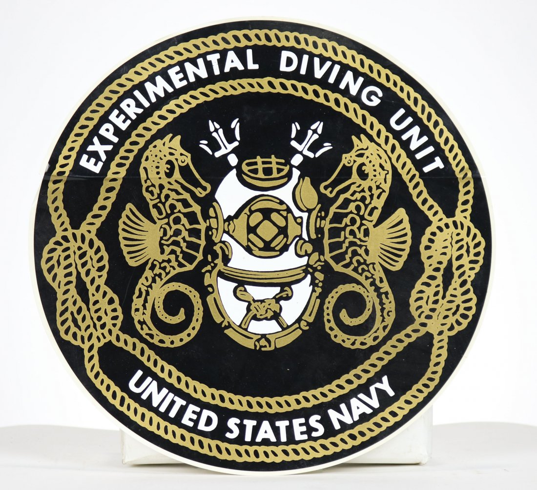 Large EDU decal: Large unused U.S. Navy Experimental Diving Unit decal with the original unit design featuring a US navy Mark V Helmet. Measures 12 inches across.