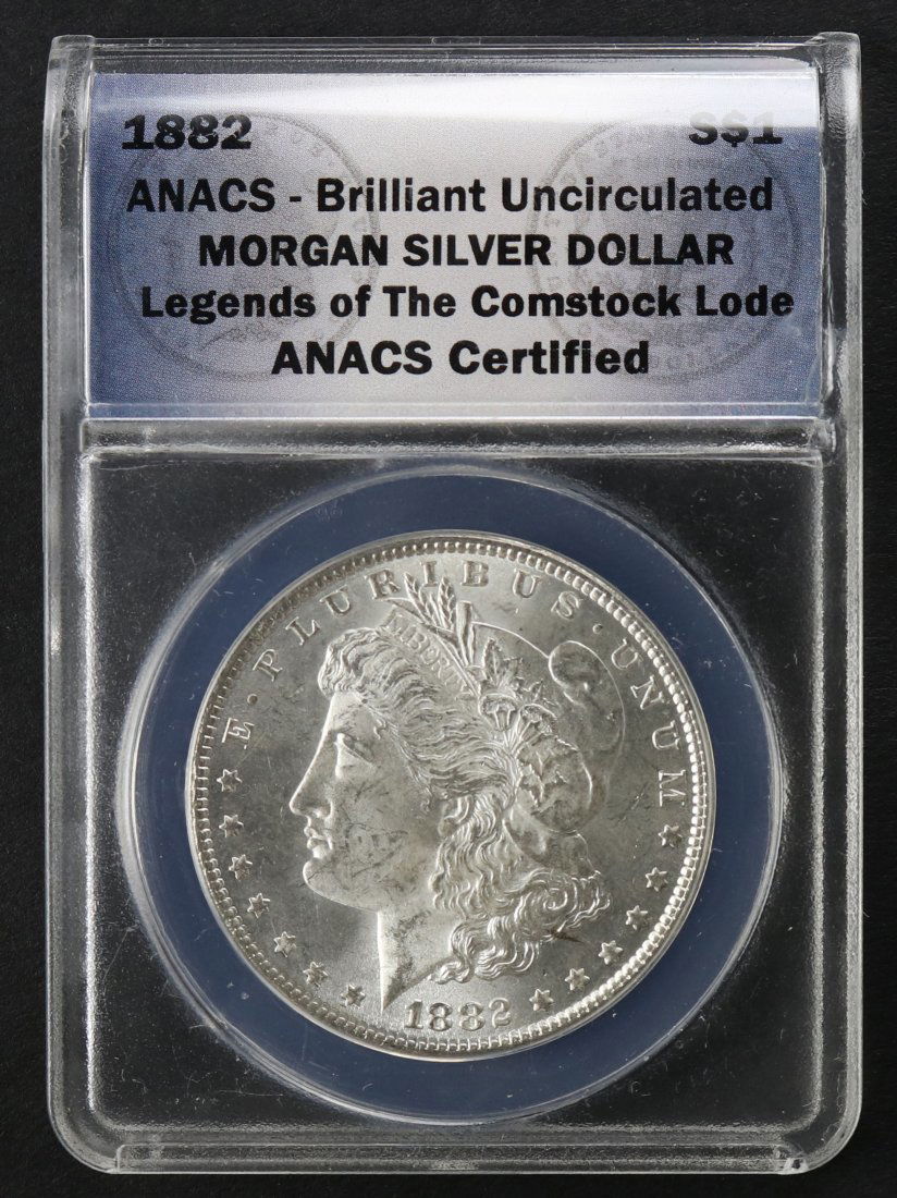 1882 Morgan Dollar Brilliant Uncirculated ANACS: 1882 US Morgan dollar coin, minted at Philadelphia, 90% silver. This coin is in brilliant uncirculated condition and was encapsulated by ANACS as part of their Legends of The Comstock Lode series.