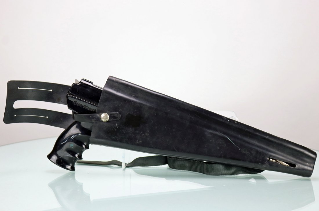 US Divers Sea Hunter Spearfishing Gun With Holster: Very nice vintage U.S. Divers Sea Hunter spearfishing gun. This piece comes with the original holster, spear shaft and tip. Gun is powered by five CO2 cartridges that are stored in spine of the holste
