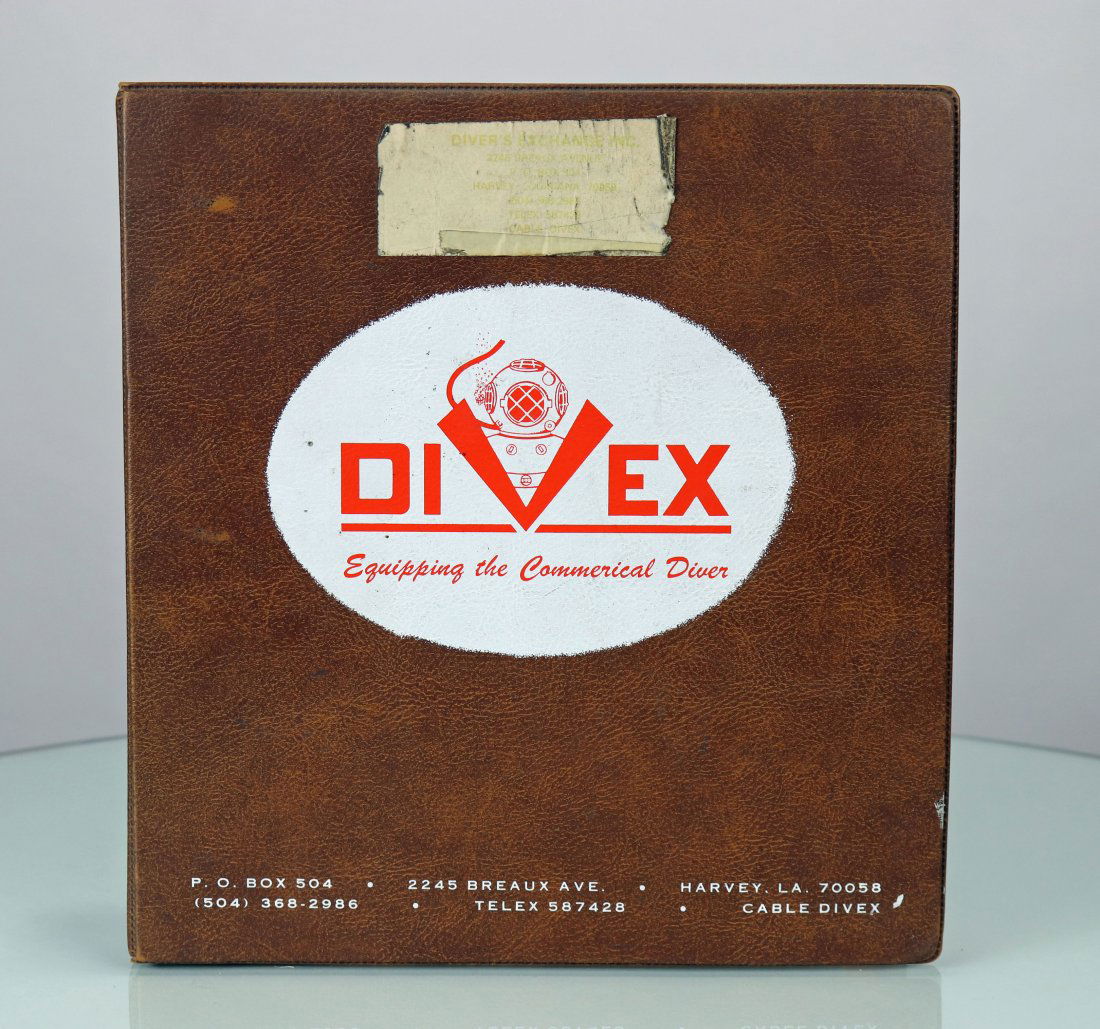 1979 Divex Diving Equipment Catalog In 3 Ring Binder: Divers Exchange or Divex original catalog. Dates to 1979 and is in the original padded 3 ring binder. Lots of information on commercial diving equipment available at the time. Some small notations on