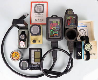 8 Vintage Scuba Dive Computers & Timers: Collection of 8 vintage scuba diving computers and timer. Grouping consists of a Suunto dive computer, ScubaPro dive timer in original box, Tekna digital dive timer in original box with instructions,