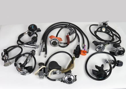 Grouping Of Vintage Single Hose Scuba Diving Regulators: Grouping of vintage single hose regulators and associated components. This lot consists of a Dacor single hose regulator that also comes with a first generation Farralon air moisturizer and a 1960s Oc