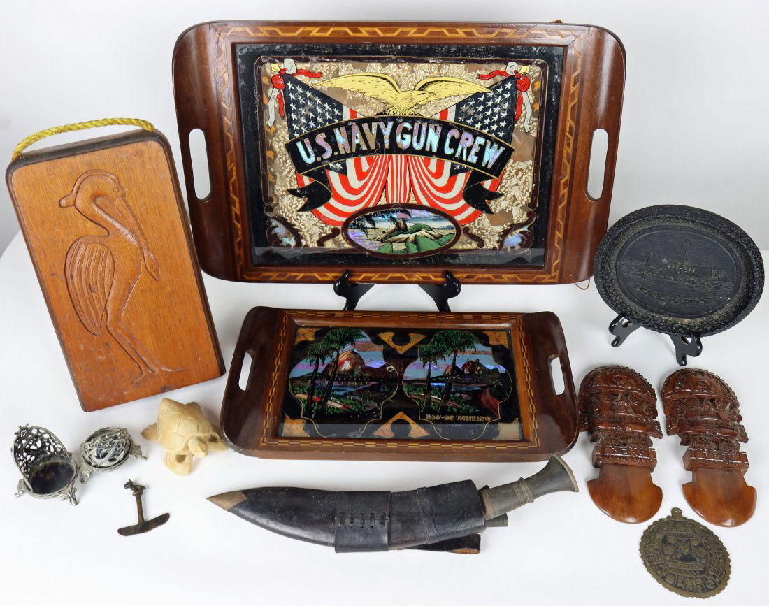 Old US Navy Gun Crew Display & Other Nautical Mementos: Grouping of assorted travel mementos from around the world. These items were acquired by a retired Navy Seal. The grouping consist of a wood game box from Antiqua with a pelican carved into the wood a