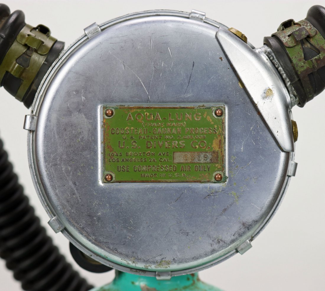 1952 USD Aqua-Lung Green Label Double Hose Regulator: Difficult to find and early US Divers double hose regulator dating to the 1952 to 1953 time period. This example features the green label, which was the third style used after black and red. Serial nu