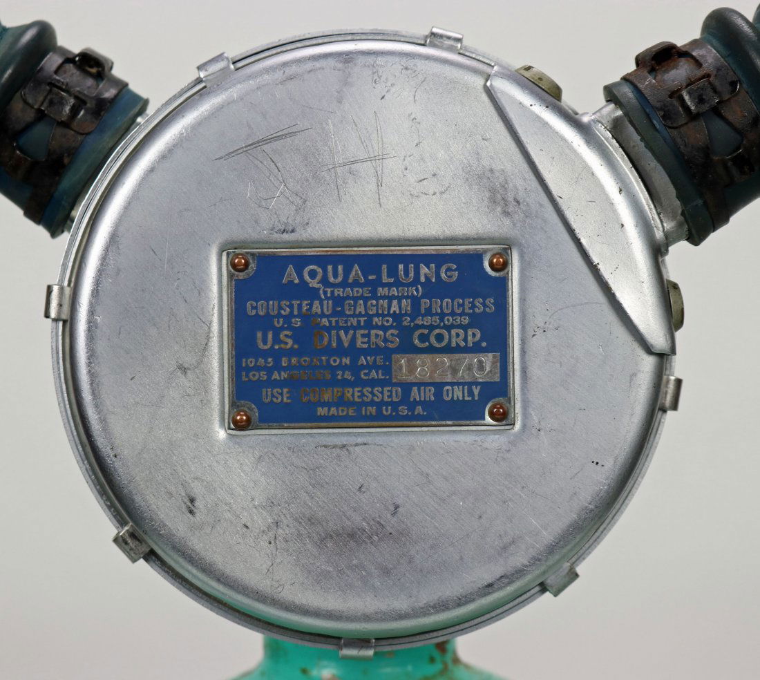Aqua-Lung Blue Label 1953 Double Hose Regulator: Difficult to find and early US Divers double hose regulator dating to the 1953 to 1955 time period. This example features the blue label, which was the forth style used after black, red, and green. Se