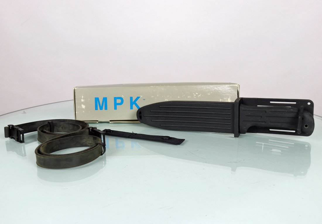 MPK Titanium Navy Seal Knife: This MPK titanium Navy Seal knife is new old stock in the original box. Mission Knives Incorporated was in San Juan Capistrano, California. The sheath is a hard black plastic, while the straps appear 