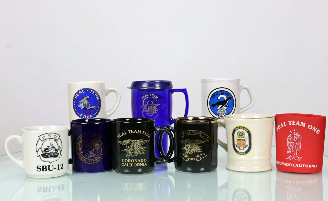 Collection of 9 US Navy Seal Team Cups & Mugs: Nice collection of nine different vintage cups, mugs and one foam can cover, all with US Navy Seal team emblems. Represented are Seal Team Four, Eight, Two, Twelve, Five, Three, One. There is also a U