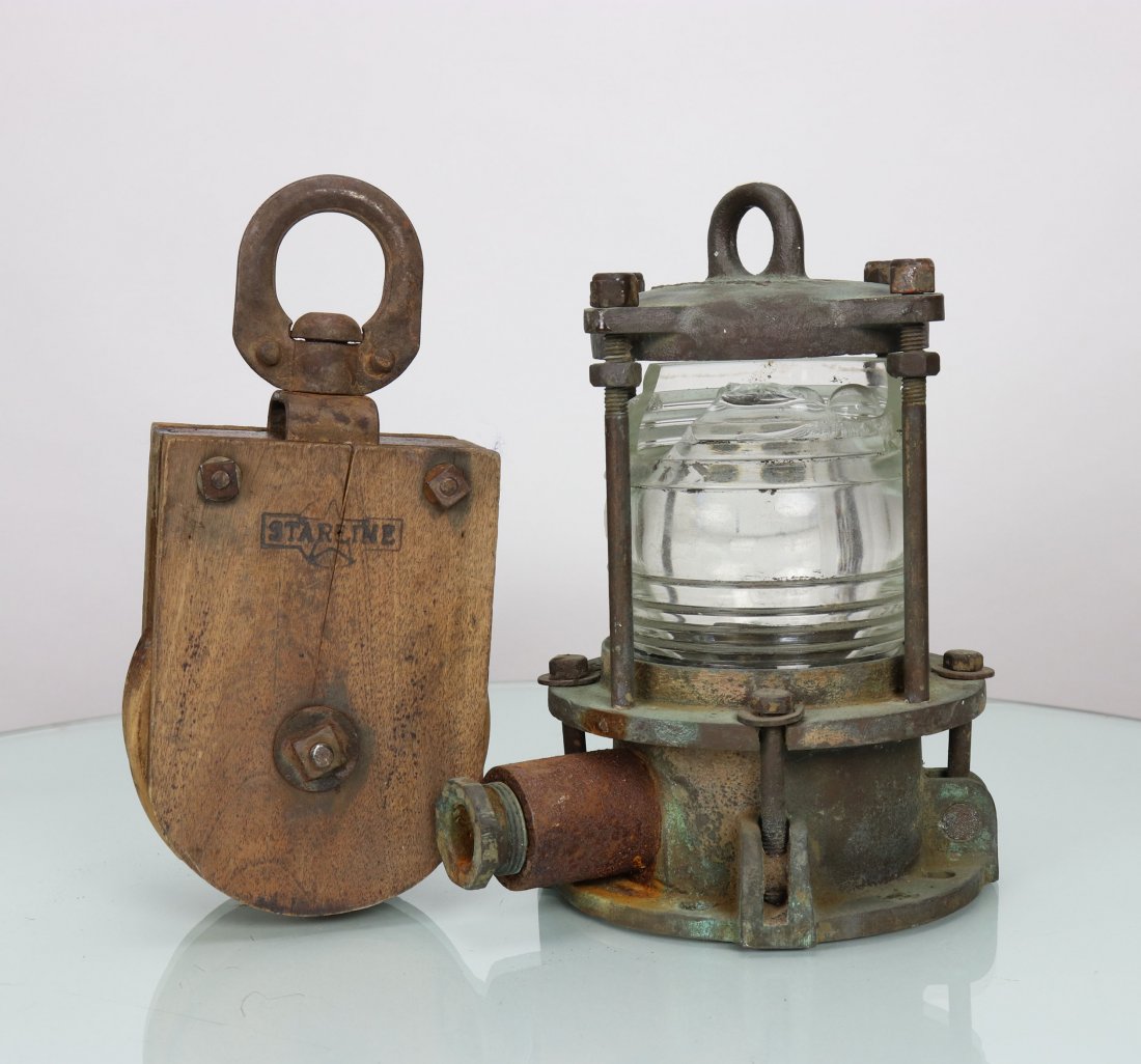 Heavy Antique Ships Passageway Light Starline Pulley: This lot consists of an antique ships passageway light and a Starline brand pulley. The light is unique in design and relatively heavy, coming in at 14 pounds! The glass lens is broken at the top. Mea