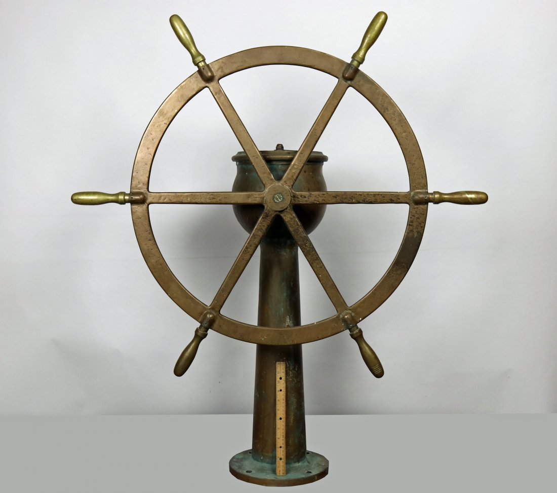 Large Vintage Dake Engine Co Ships Wheel & Pedestal: This is a very impressive and authentic ships wheel and pedestal. Made by the Dake Engine Company in Grand Haven, MI, we are unsure of its age but it is likely pre-WW2. Made of solid brass, the wheel 