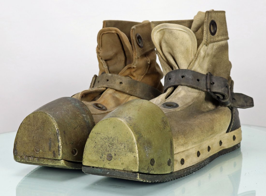 Pair of Lightweight Canvas Divers Boots: Nice pair of vintage lightweight divers boots. Boots feature canvas body, leather strap, wood insole, brass corrugated sole, brass toe and leather heal. Each boot weighs approximately 10 pounds each. 