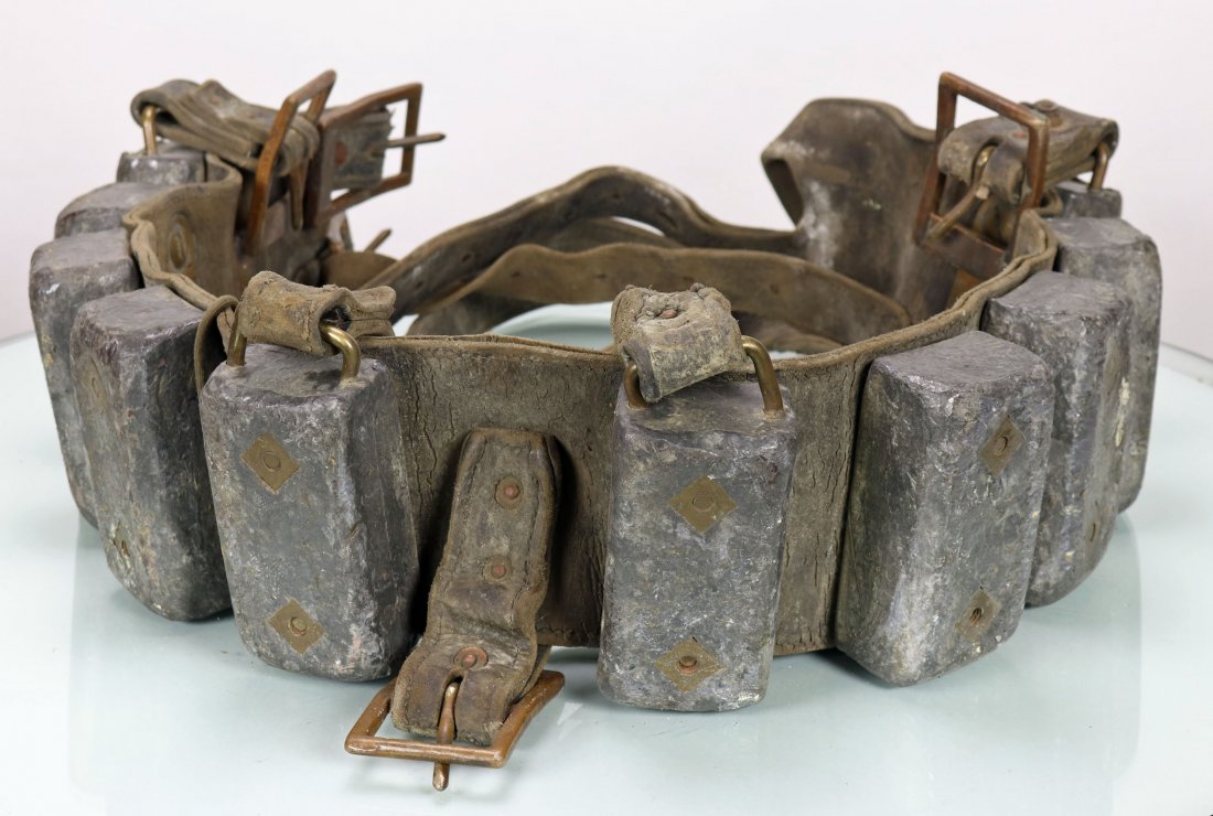 Vintage Divers Weight Belt With 10 Lead Ingots: Vintage leather divers weight belt with all 10 original lead ingots. Leather shoulder straps are present as well. No jock strap. Leather is well worn and stiff. None of the weights have a manufactures