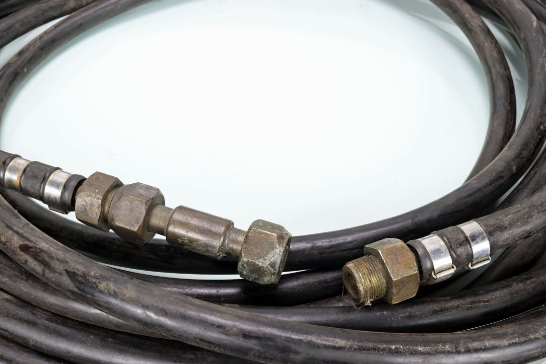50 Feet Of Mark V Divers Air Line & Brass Fittings: This is a roll of approximately 50 feet of divers air line of unknown age. The line was used with the Mark V diving helmet and has the brass fittings as well as a double female connector attached. We 