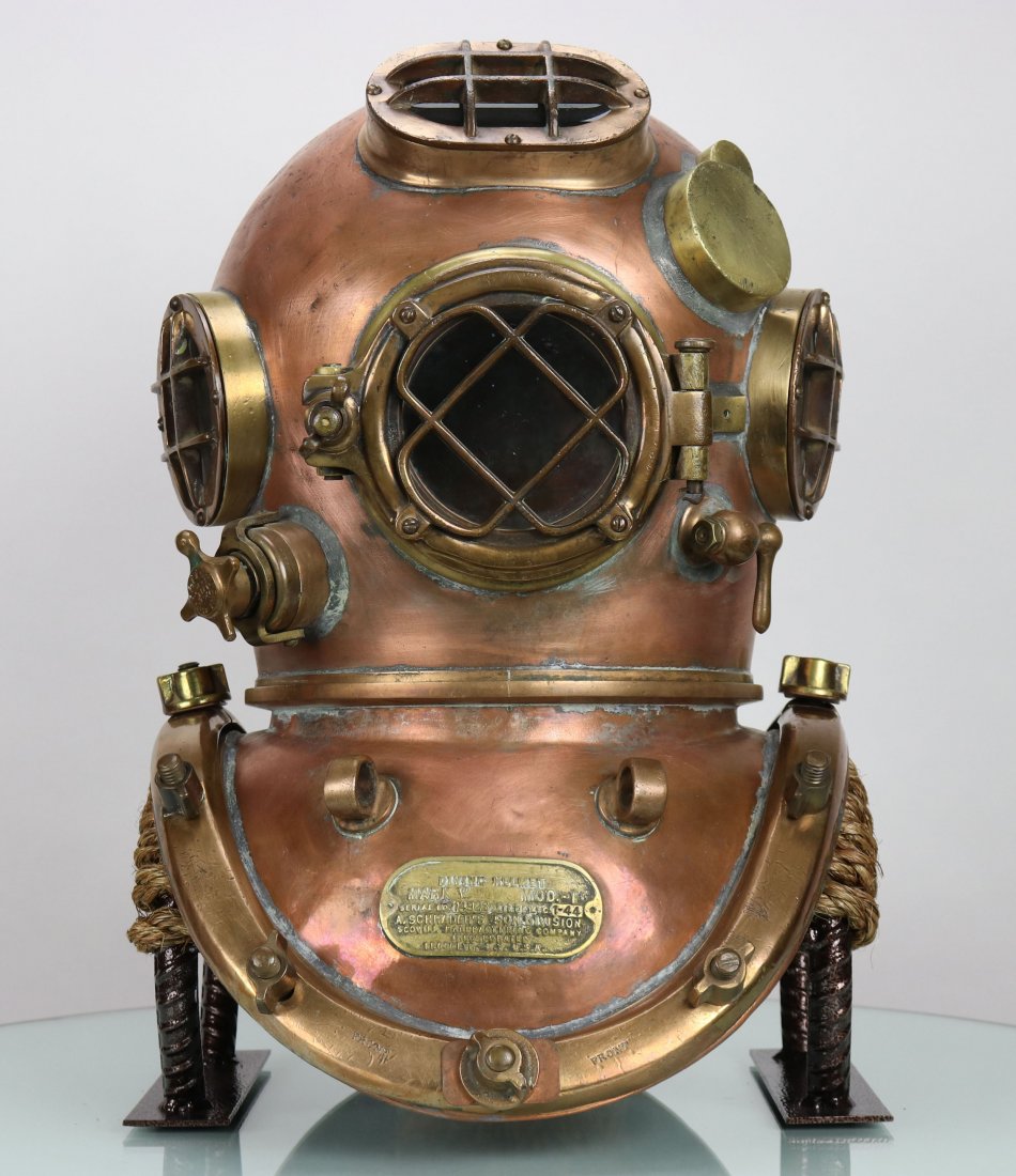 1944 United States Navy Mark V Diving Helmet Schrader: The US Navy Mark V is arguably the most iconic helmet design ever made. Its style and history have made it one of the most popular helmets among collectors worldwide. The model was made for the US Nav