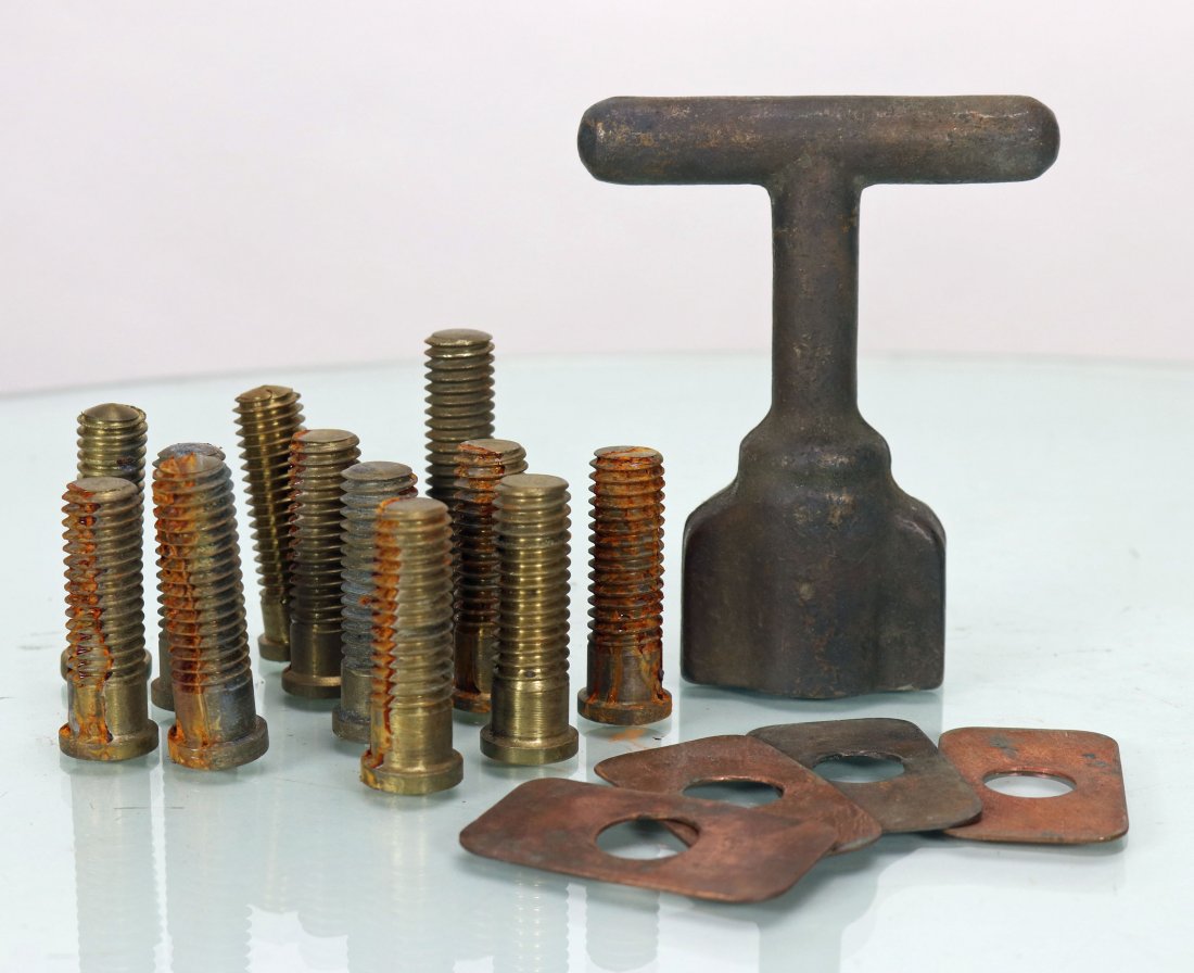 USN Mark V Diving Helmet Studs, T Wrench & Brail Shims: This is a grouping of difficult to find US Navy Mark V diving helmet parts. The group consists of a full set of breastplate studs including the longer bastard stud, 4 copper brail shims and a wing nut
