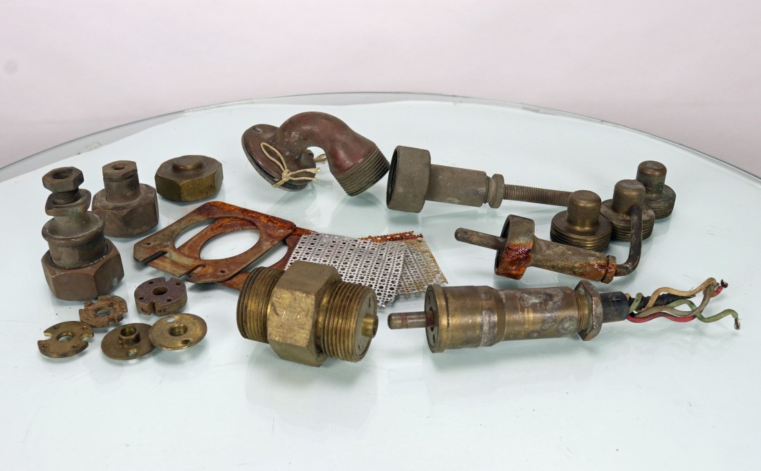 Mark V Diving Helmet Communications Fittings Lot + More: Grouping of difficult to find original communications related parts. The collection includes a Mark V diving helmet communications elbow, single pin comms line fittings, reproducer parts, caps, etc. A