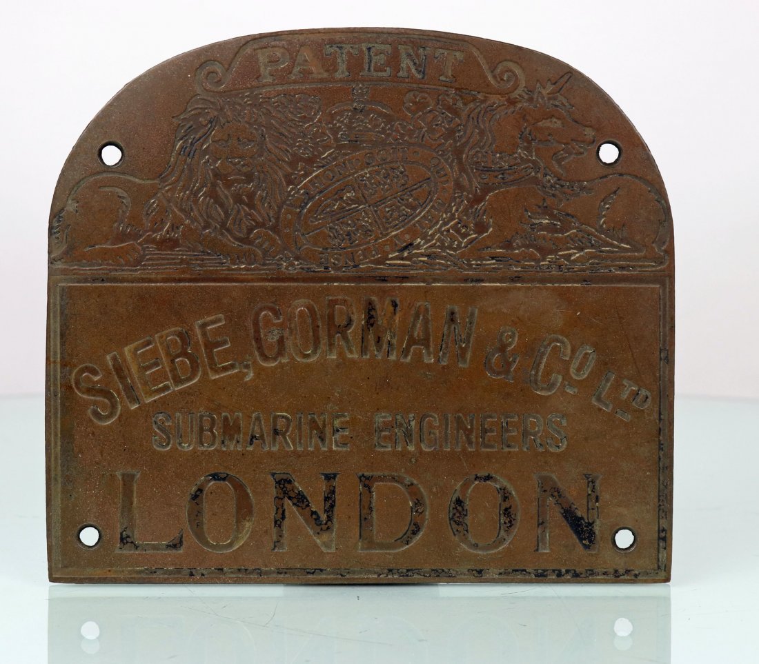 Siebe Gorman & Co Ltd Brass plaque NOS: A New Old Stock (NOS) sheet brass Siebe Gorman & Co. Ltd plaque from mid last century. Heavy patina on both sides with some fading on the black paint of the stamped lettering. Would make a great looki