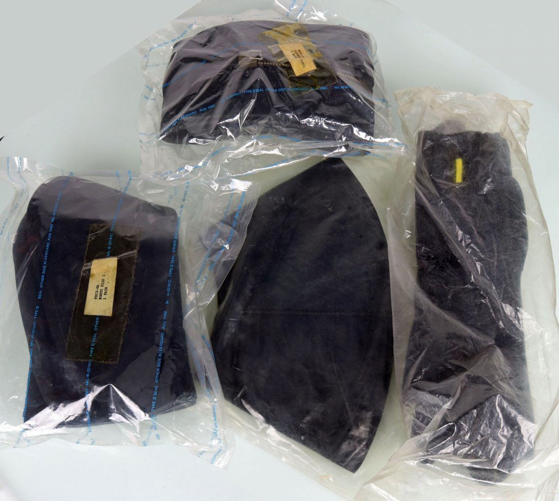 Mark 12 Neoprene Boots, Zipper Panel, Neck Dam, Gloves: This is a grouping of new old stock US Navy Mark 12 diving system neoprene components. Items consist of a pair of size 1 boots, 1 zipper panel, helmet neck dam, and gloves with #1 on them. All items w