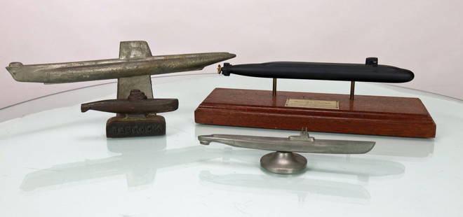 4 Vintage Submarine Display Models: This grouping is for 4 vintage submarine models. The pieces include a presentation model on wood with a plaque that says: Presented to Horatio S. Stanton 37 years Electric Boat Corporation, the base