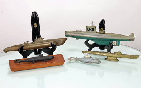 Five Vintage Submarine Model Grouping: This lot features a total of 5 different submarine models. The first piece is a silver and green plastic toy, the U8, which measures 13 inches long and was made by Play Art in Hong Kong. The second