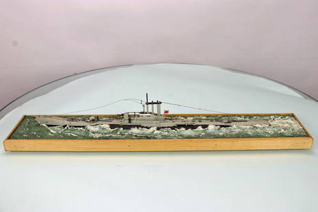 HMS Aurochs P426 Detailed Scale Model 192 to 1: This is an incredible highly detailed painted model of the HMS Aurochs submarine. The piece measures 22 inches long. A wood border goes around the entire edge. One of the tiny guide wires is snapped o