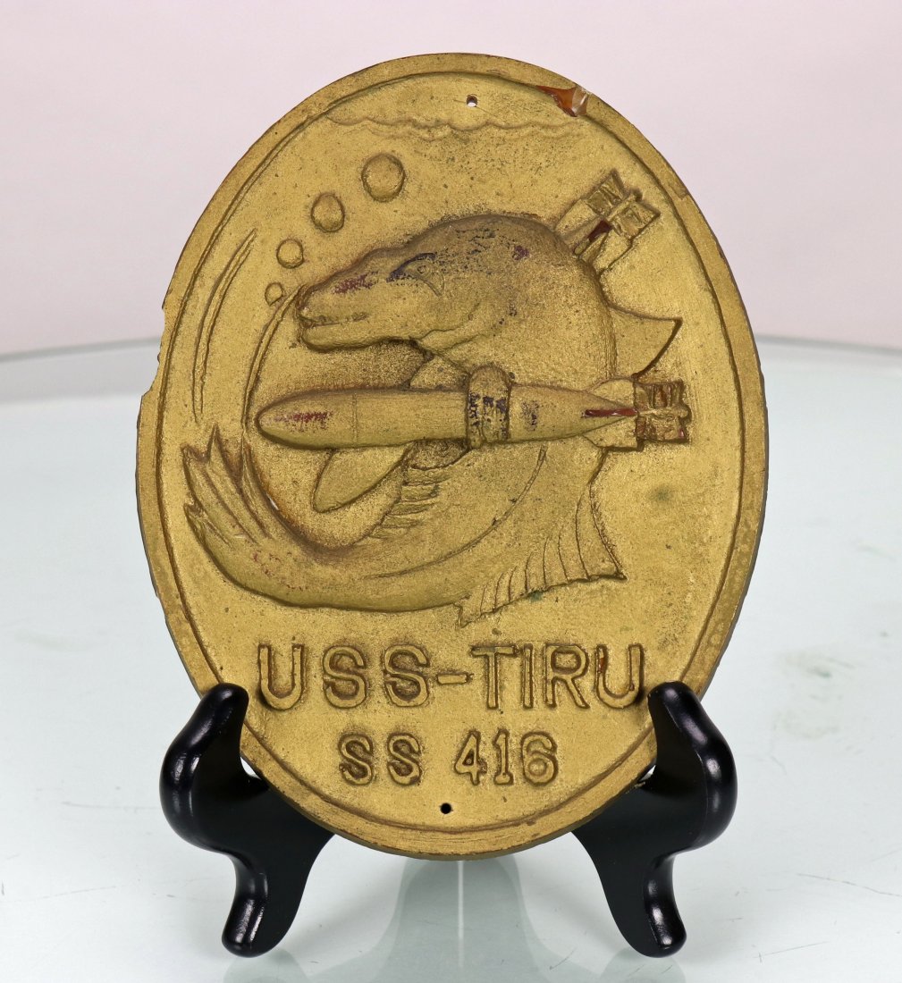 USS Tiru SS 416 Submarine Plaque: This is a vintage USS Tiru SS 416 submarine resin plaque. Measures 5 inches wide and 6.25 inches tall. There is some damage to the left edge. A great image of a tiru fish holding a torpedo. All items