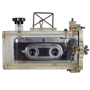 1950s Wirgin 3D 35mm Camera With Underwater Housing: This is a scarce circa 1950s 3D Sterio camera made by Wirgin. This camera features two f/3.5 33mm lenses. The camera is housed in a heavy underwater acrylic housing. The camera has not been tested. Th