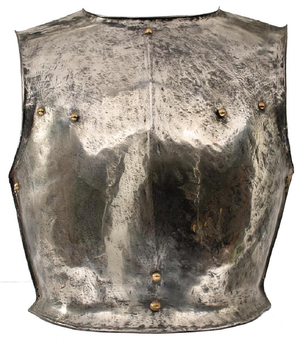 AN 18TH CENTURY NORTH EUROPEAN CUIRASSIER'S: AN 18TH CENTURY NORTH EUROPEAN CUIRASSIER'S BREASTPLATE, of heavy construction with raised medial ridge and crudely turned edges, brass rivet decoration, together with a modern Spanish type breastplat