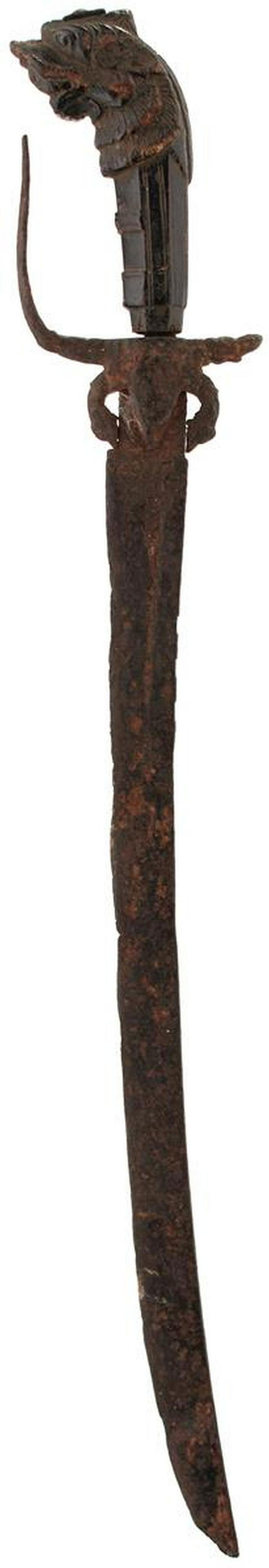 TWO SINHALESE OR CEYLONESE KASTANE OR SHORT SWORD: TWO SINHALESE OR CEYLONESE KASTANE OR SHORT SWORD, the first with 51cm curved blade, inlaid with a geometric panel in brass at the forte, characteristic horn hilt, chipped, the various quillons and te