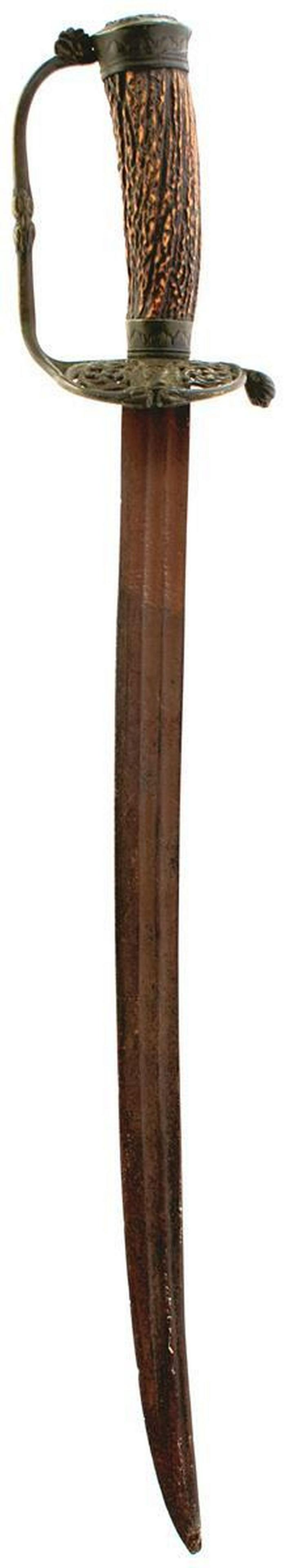 A 17TH CENTURY HANGER, 44.75cm double fullered blade,: A 17TH CENTURY HANGER, 44.75cm double fullered blade, characteristic brass hilt, the downturned guard pierced with scrolling foliage and cast with a crowned profile bust, D-shaped knuckle guard, folia