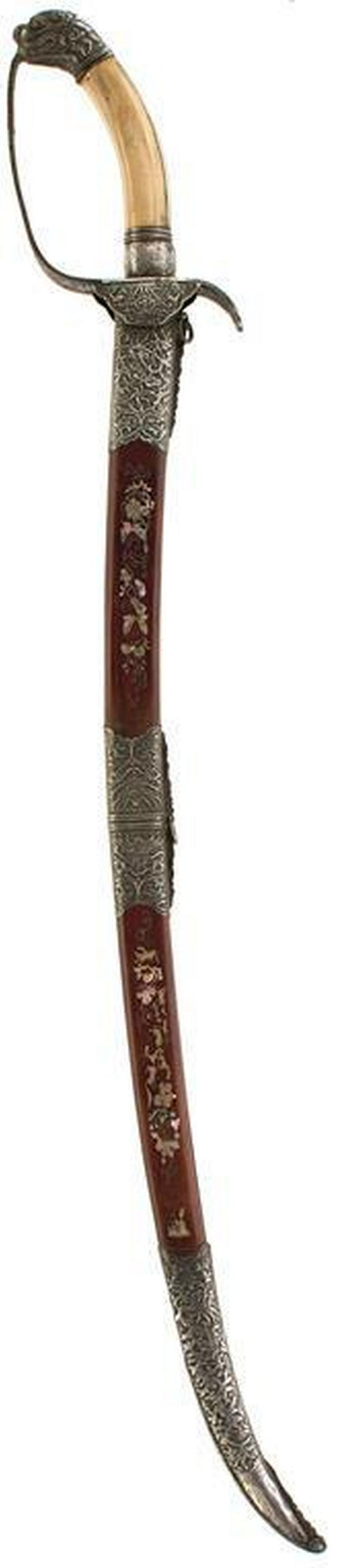 A 19TH CENTURY VIETNAMESE KIEM OR SWORD, 66cm curved: A 19TH CENTURY VIETNAMESE KIEM OR SWORD, 66cm curved double fullered blade engraved with swirling smoke, characteristic white metal hilt decorated with dragons and foliage, dragon's head pommel, polis