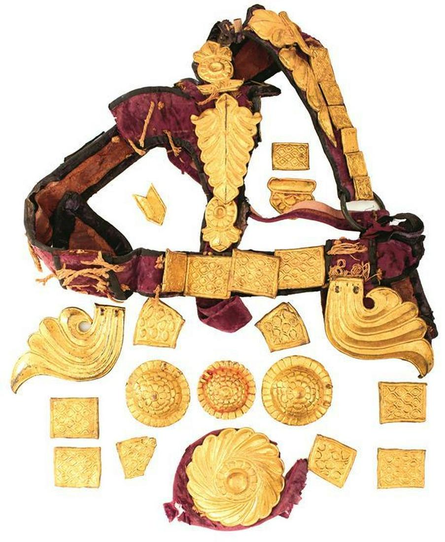 A 19TH CENTURY INDIAN HORSE HARNESS, comprising purple: A 19TH CENTURY INDIAN HORSE HARNESS, comprising purple velvet covered hide bridle with gilt metal mounts, and various further matching gilt metal accoutrements. Some losses.