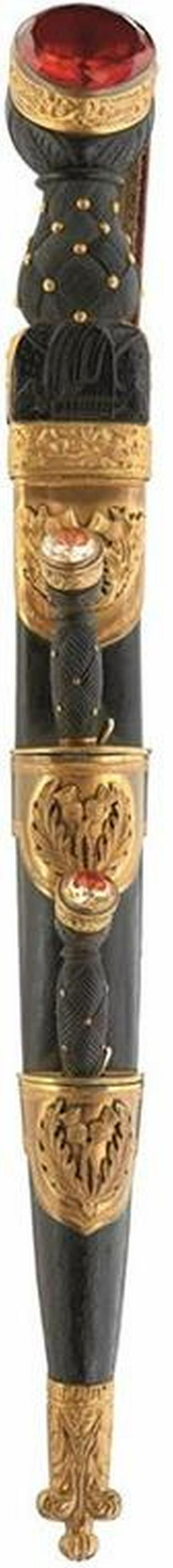 A SCOTTISH REGIMENTAL DIRK OF THE SEAFORTH HIGHLANDERS,: A SCOTTISH REGIMENTAL DIRK OF THE SEAFORTH HIGHLANDERS, 30.5cm blade with faceted back edge etched with scrolls, thistles and crowned G.R.V. cypher, carved wood basket weave hilt with gilded brass mou