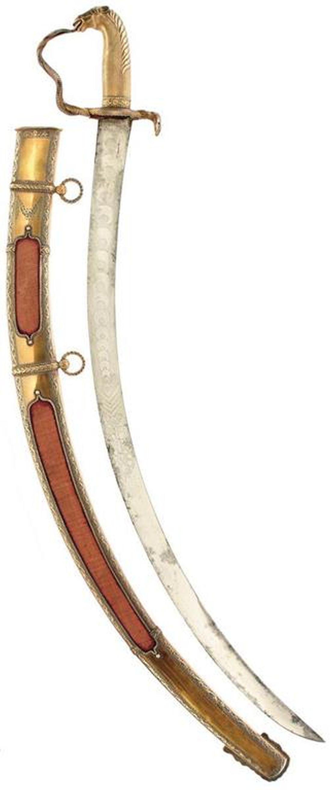 A FINE INDIAN ARMY HORSE'S HEAD PRESENTATION SWORD TO: A FINE INDIAN ARMY HORSE'S HEAD PRESENTATION SWORD TO THE MADRAS ARTILLERY, 70.5cm sharply curved blade etched with diminishing crescents, finely chiselled gilt horse's head stirrup hilt, the knuckle 