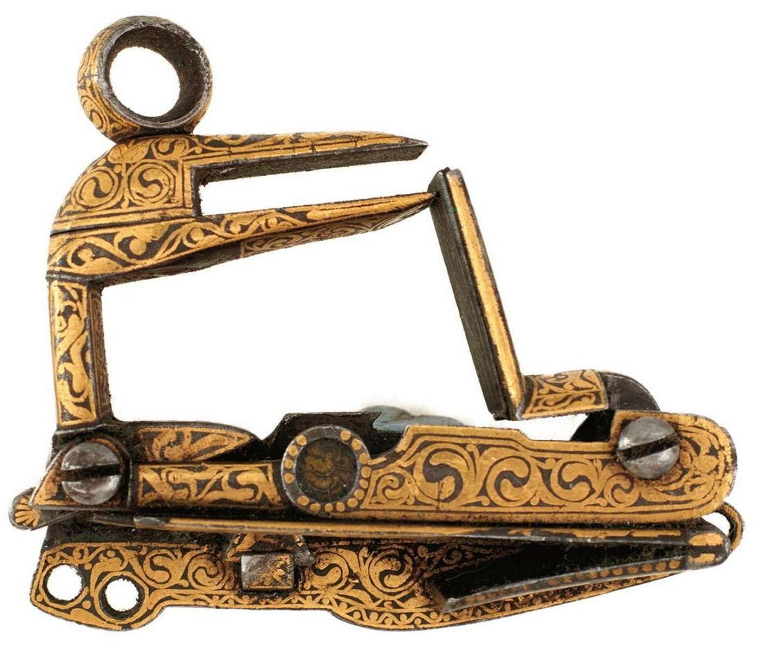 A DETACHED CAUCASIAN MIQUELET LOCK, finely decorated: A DETACHED CAUCASIAN MIQUELET LOCK, finely decorated with scrolling foliage in gold koftgari, circular maker's stamp, the underside of the external spring with a panel of calligraphy.